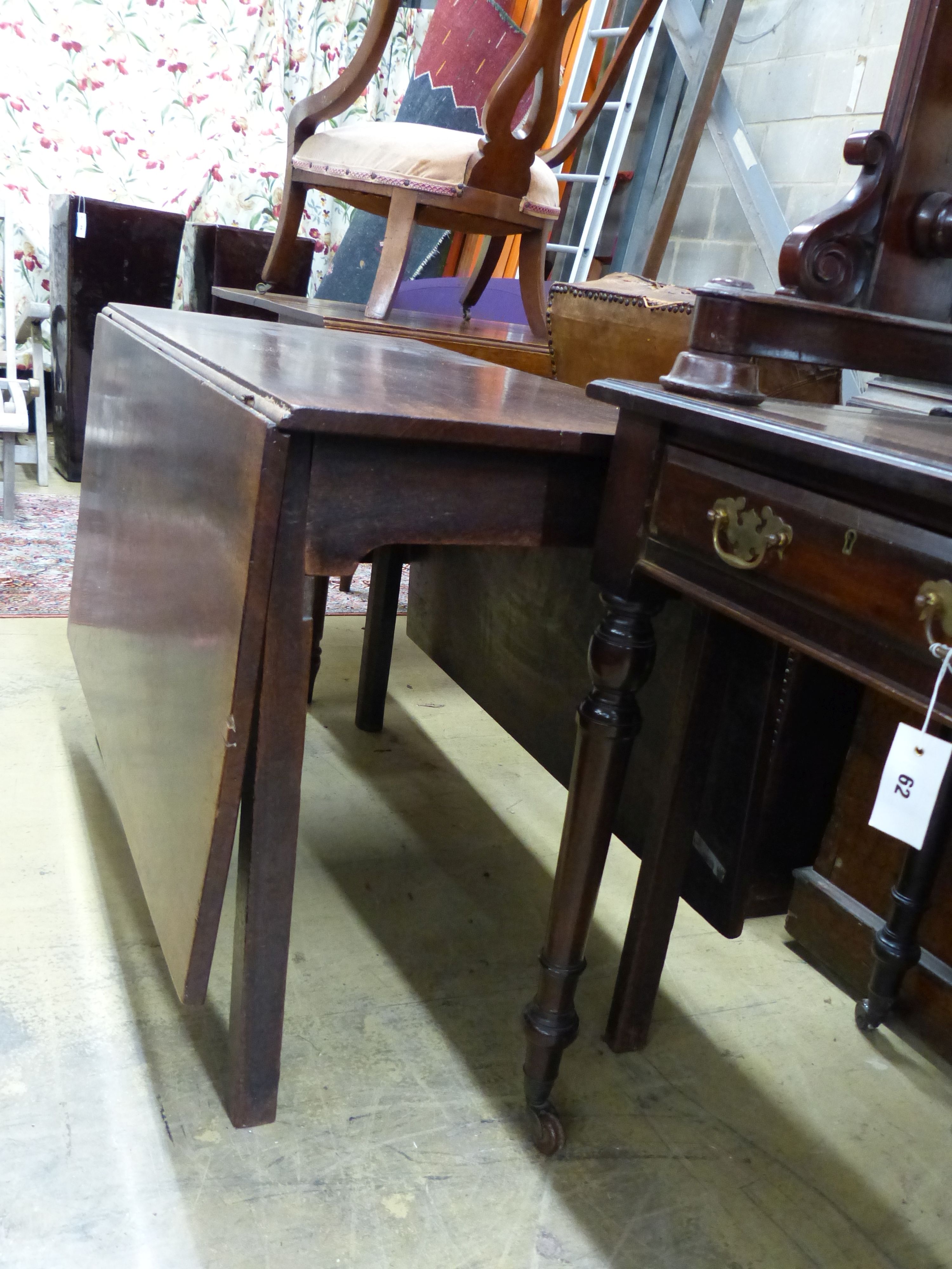 A George III mahogany drop leaf dining table, length 104cm